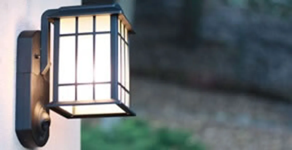 security light installation services with professionally mounted exterior wall light in Houston, TX